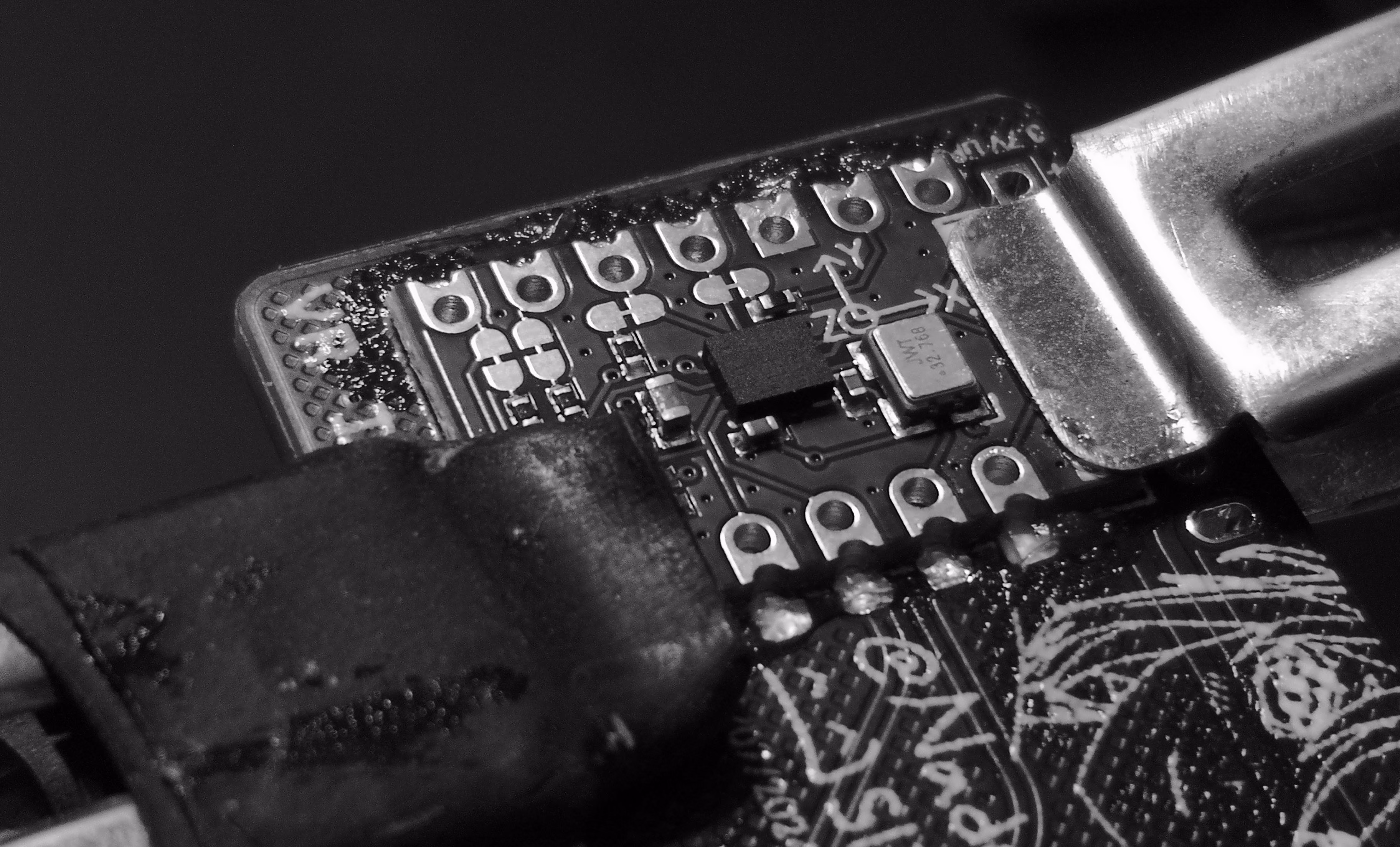 Clamp IMU module to backside of PCB with helper clamps and apply flux