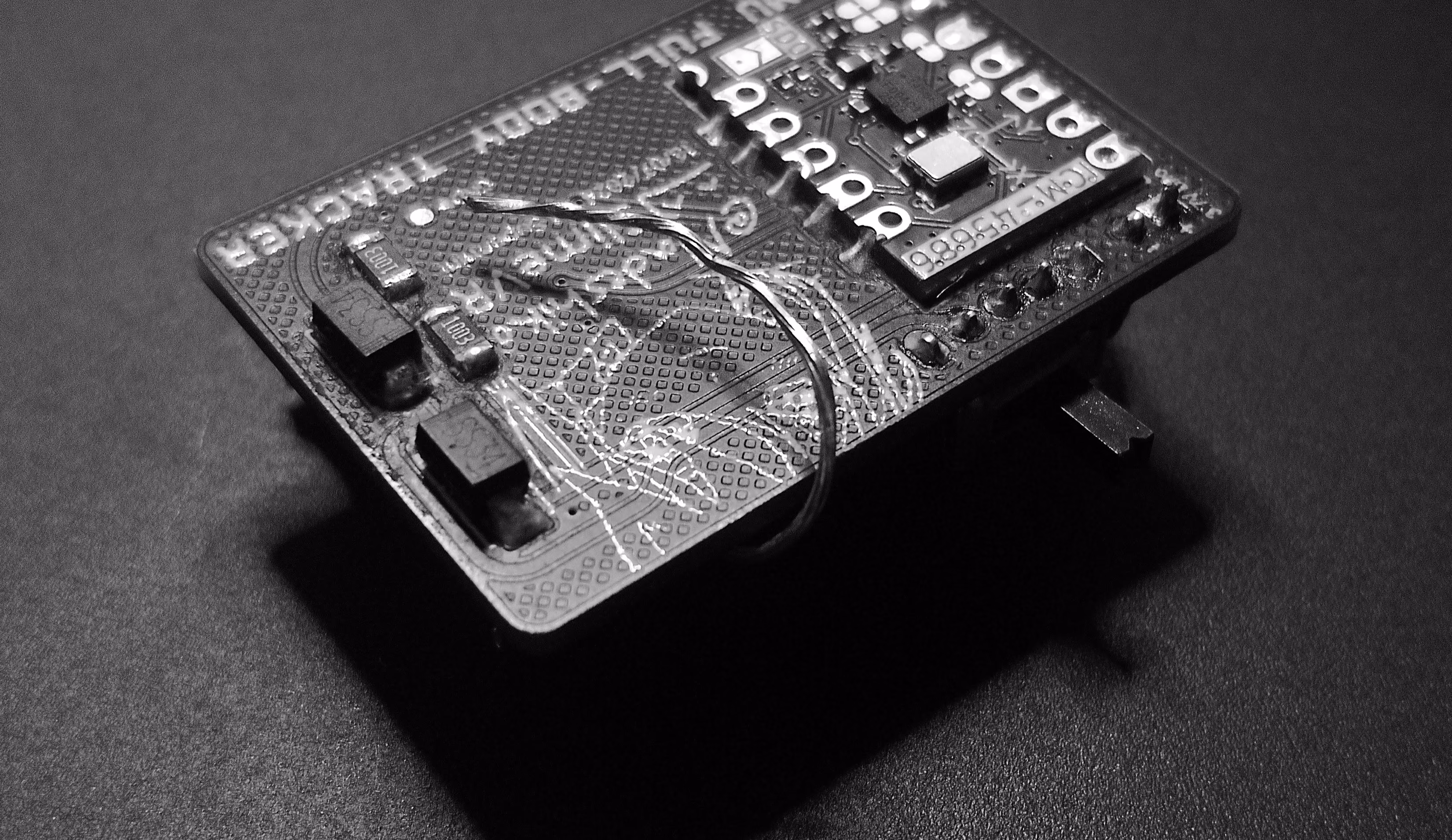 Wire antenna bent under the PCB so it only travels through the case